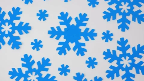 White winter rotating background with pattern of decorative blue snowflakes. 4k. Stock Footage 223428447