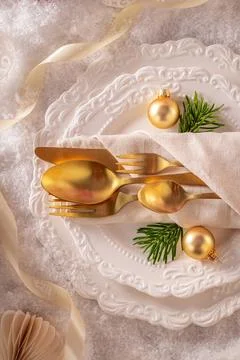 White winter table adorned with festive ornaments. Stock Photos