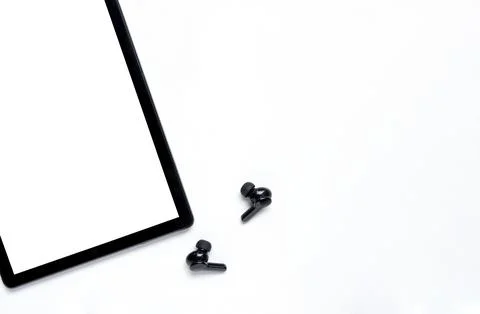 White wireless bluetooth headphones with tablet computer Stock Photos