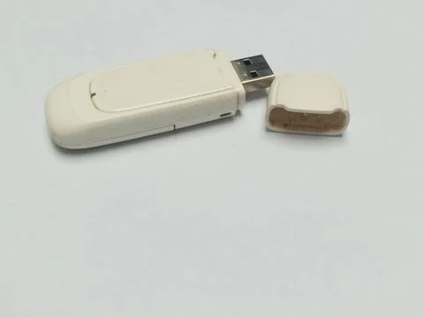 White wireless cellular usb modem isolated on white background Fotos Stock