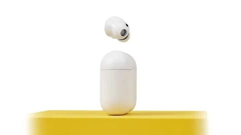 White wireless earbuds and charging case on yellow platform  modern technol.. Stock Footage 331239939