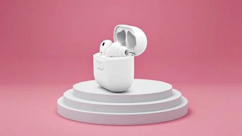 White wireless earbuds in open charging case on pink background  modern tec.. Stock Footage 331239936