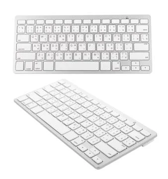 White wireless keyboard on white background Stockfoto's