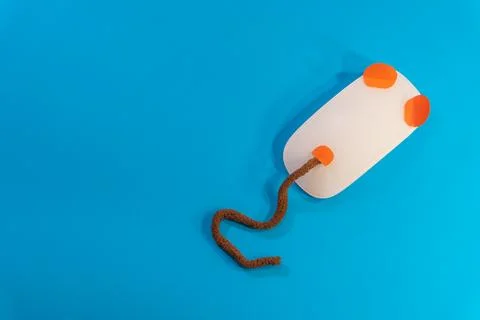White wireless mouse on blue background Stock Photos