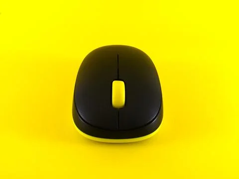 White wireless mouse on yellow background, minimal, flatlay Stock Photos