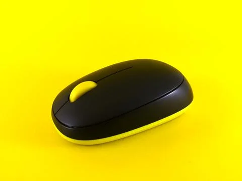 White wireless mouse on yellow background, minimal, flatlay Stock Photos