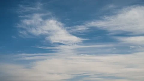 White wispy spring clouds drifting through a blue sky. Stock Footage 149892413