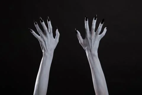 White witch hands with sharp black nails Stock Photos