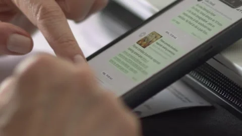 White woman using fingertips to scroll, text on mobile device, closeup Stock Footage 292970844