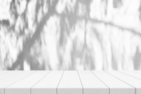 White Wood Table with Pine Tree Shadow on Concrete Wall Texture Background Stock Photos