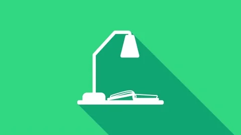 White Workplace with table lamp and open book icon isolated on green background Stock Footage 146946454
