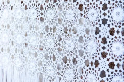 White woven lace patterned tablecloth Stock Photos
