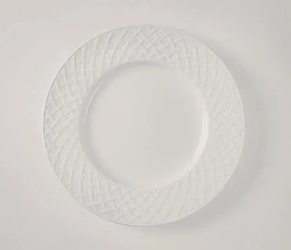 White woven pattern plate with center hole Stock Photos
