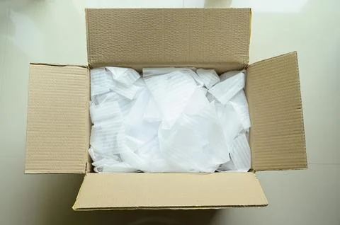 White wrap bubble put in brown box Stock Photos