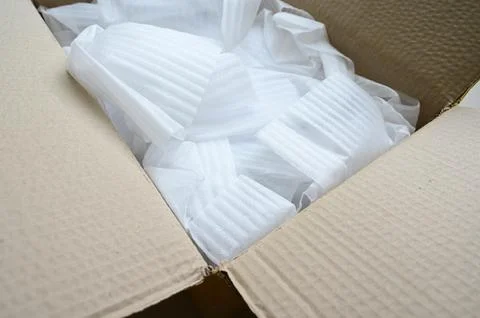 White wrap bubble put in brown box Stock Photos