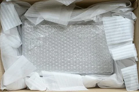 White wrap bubble put in brown box Stock Photos