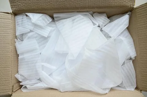 White wrap bubble put in brown box Stock Photos