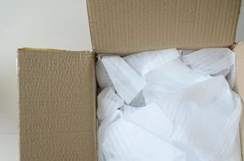 White wrap bubble put in brown box Stock Photos