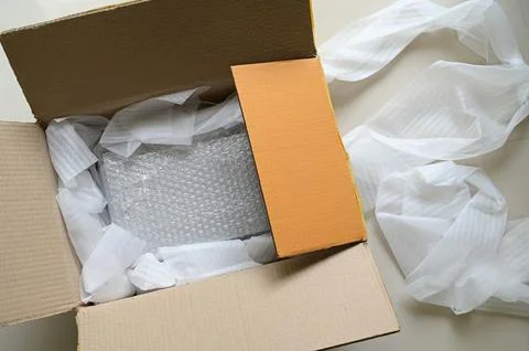 White wrap bubble put in brown box Stock Photos