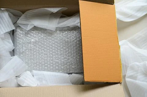 White wrap bubble put in brown box Stock Photos