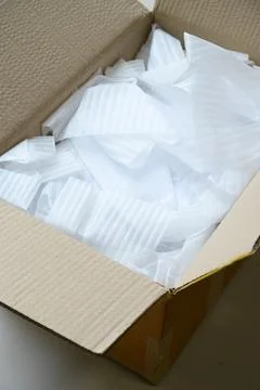 White wrap bubble put in brown box Stock Photos