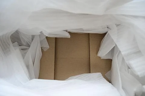 White wrap bubble put in brown box Stock Photos