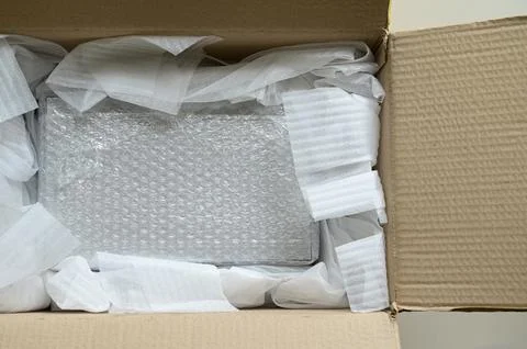 White wrap bubble put in brown box Stock Photos