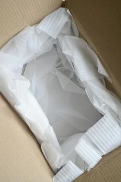 White wrap bubble put in brown box Stock Photos