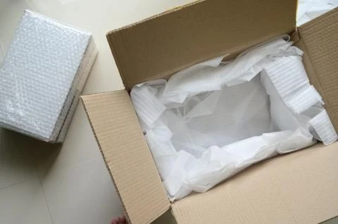 White wrap bubble put in brown box Stock Photos