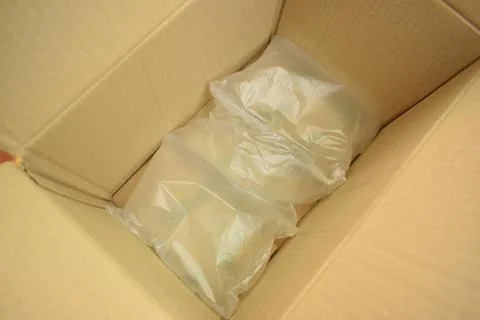 White wrap bubble put in brown box Stock Photos