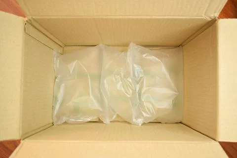 White wrap bubble put in brown box Stock Photos