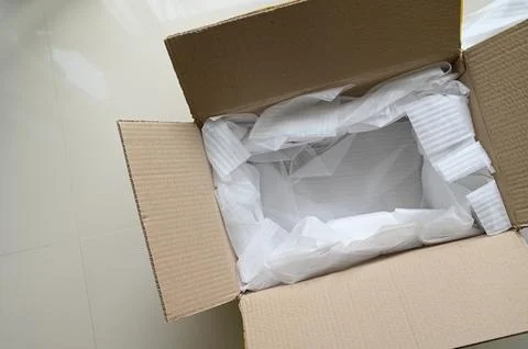 White wrap bubble put in brown box Stock Photos