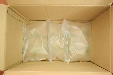 White wrap bubble put in brown box Stock Photos