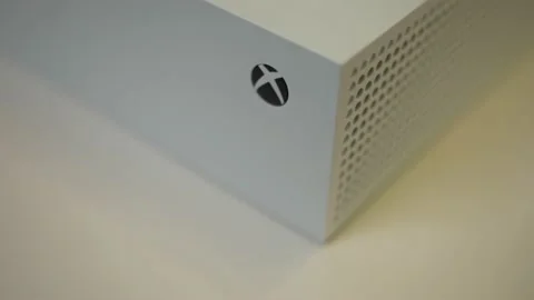 A white Xbox series s console on top a turn table slowly moving Stock Footage 158735606