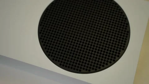 A white Xbox series s console on top a turn table slowly moving Stock Footage 158735626