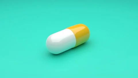 White-Yellow pills isolated rotating on green background. Video stock 132943786