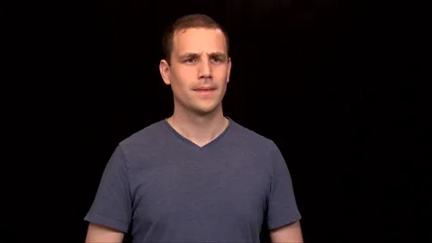 A white young Man on black background is confused Vidéo 146263612