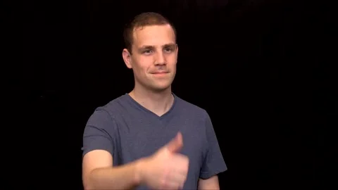 A white young Man on black background puts a thumb up impressed Vidéo 146263623