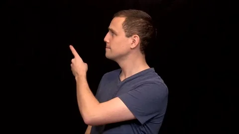 A white young Man on black background points and then is in agreement Vidéo 146263712