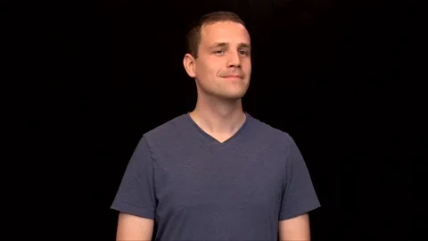 A white young Man on black background winks Vidéo 146263721