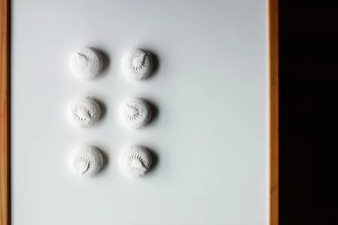 White zephyr marshmallows on white table with wooden sides Stock Photos