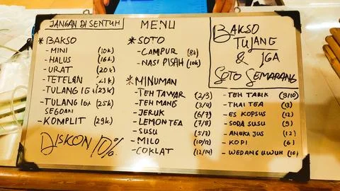 Whiteboard menu with handwritten food selection in eatery Stock Photos
