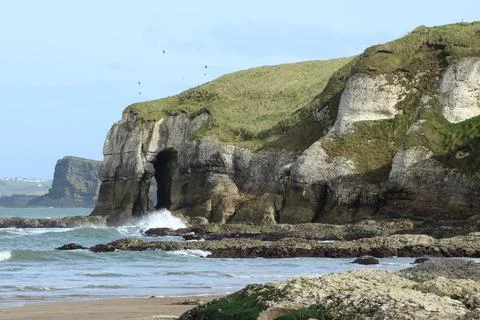 Whiterocks Beach with backdrop of cliffs Stock Photos