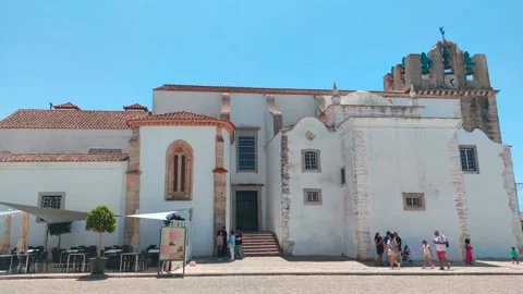 Whitewashed Cathedral with Bell Tower and Cafe Terrace, Faro, Algarve, Portugal Stock-Footage 249808364
