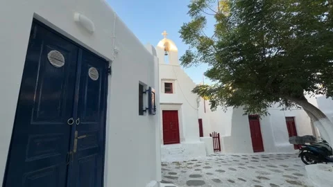 Whitewashed Cobblestone Square Mykonos - Church and Blue Door Stock Footage 346732624
