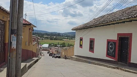 Whitewashed House With Red Trim on Quiet Town Street, Guasca, Colombia 8K Stock Footage 331521853
