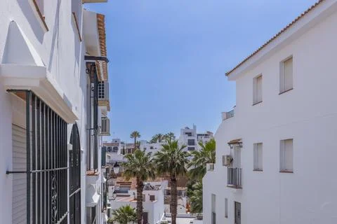 Whitewashed Street with Palm Trees in Ayamonte, Andalusia, Spain Stock Photos