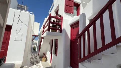 Whitewashed Street with Red Door and Balcony Mykonos Greece Stock Footage 346736147