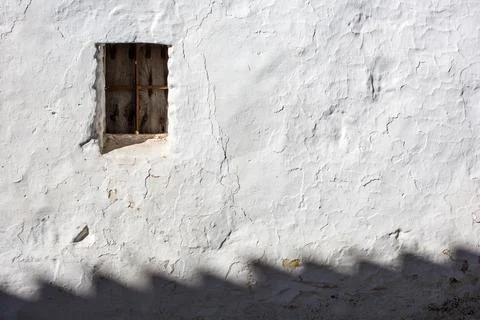 Whitewashed Wall With Window in Afternoon Light, Villaviciosa De Cordoba Stock Photos