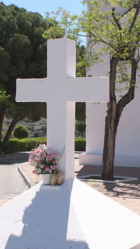 Whitewashed white cross on the door of an Andalusian hermitage, Tilt Stock Footage 332894889